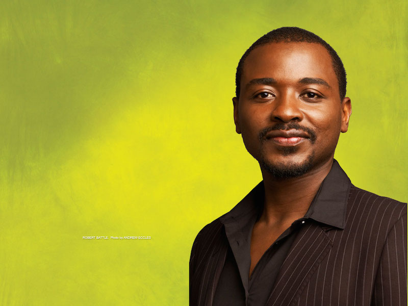 A headshot of Robert Battle behind a lime green background